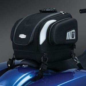 Perfect day or weekend bag, it is just the right size to store what you need! The contoured bottom and removable base pad provides perfect mounting on both passenger seats or luggage racks! Dims: 14” wide X 12” deep X 12” tall Cubic inches: 1,512 (internal main compartment) Contoured Base with removable pad provides a recessed bottom for coordinating with seats or luggage racks when needed Padded electronics pockets in multiple sizes to fit a variety of devices, including up to a 10” tall x 8-1/4” wide tablet Internal side elastic pockets and smaller mesh zippered pockets on the lid allow organization to be maintained inside the bag Contoured design provides a streamlined appearance to the back of your bike. Thermoformed side compartments with internal storage pockets Constructed with premium UV-rated, weather-resistant 1200 denier Maxtura® material Custom thermoformed construction with integrated internal support structure for durability and shape retention Premium lined interior with multiple pockets and compartments for easy organization throughout each bag Reflect-A-Light®: Strategically placed custom reflective patches for increased visibility Heavy duty metal-welded D-rings with anti-scratch plastic coating and secured with riveted, sewn box-and-cross premium attachment Protected by weatherproof zippers with glove-friendly and stylish zipper pulls Unique style to follow the contours of virtually any motorcycle and provide secure mounting Includes durable, adjustable mounting straps, ergonomically styled carrying handle, and a rain cover